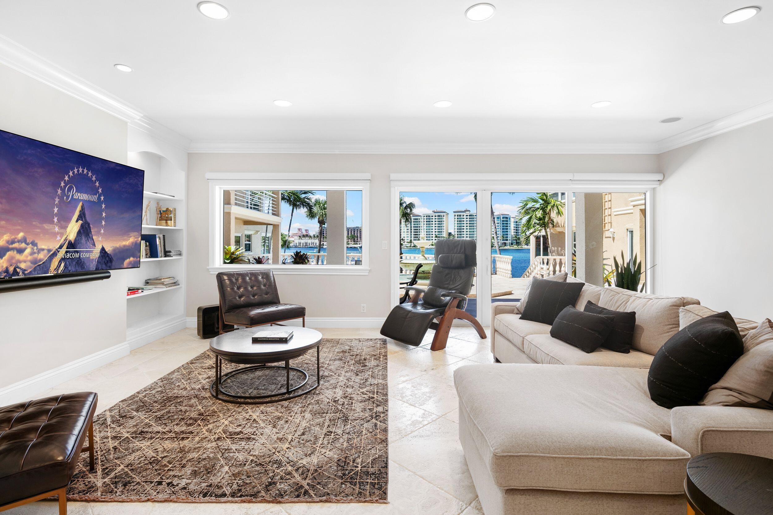 555 South Ocean Boulevard, Unit 4 Boca Raton, FL 33432 - Photo 11 of 39 a living room with furniture and a rug