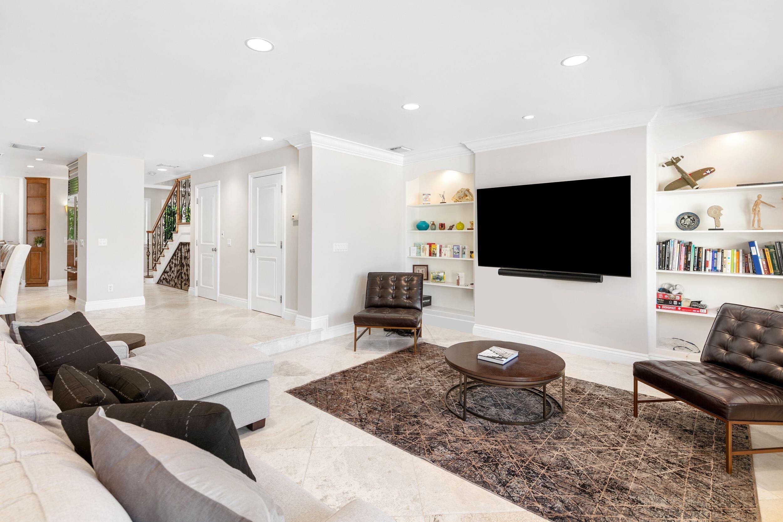 555 South Ocean Boulevard, Unit 4 Boca Raton, FL 33432 - Photo 12 of 39 a living room with furniture and a flat screen tv