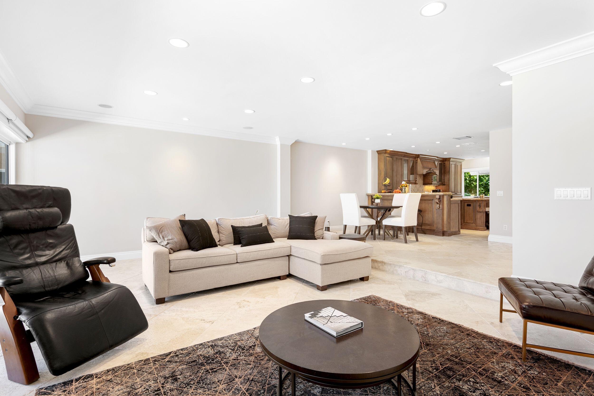 555 South Ocean Boulevard, Unit 4 Boca Raton, FL 33432 - Photo 14 of 39 a living room with furniture and a table