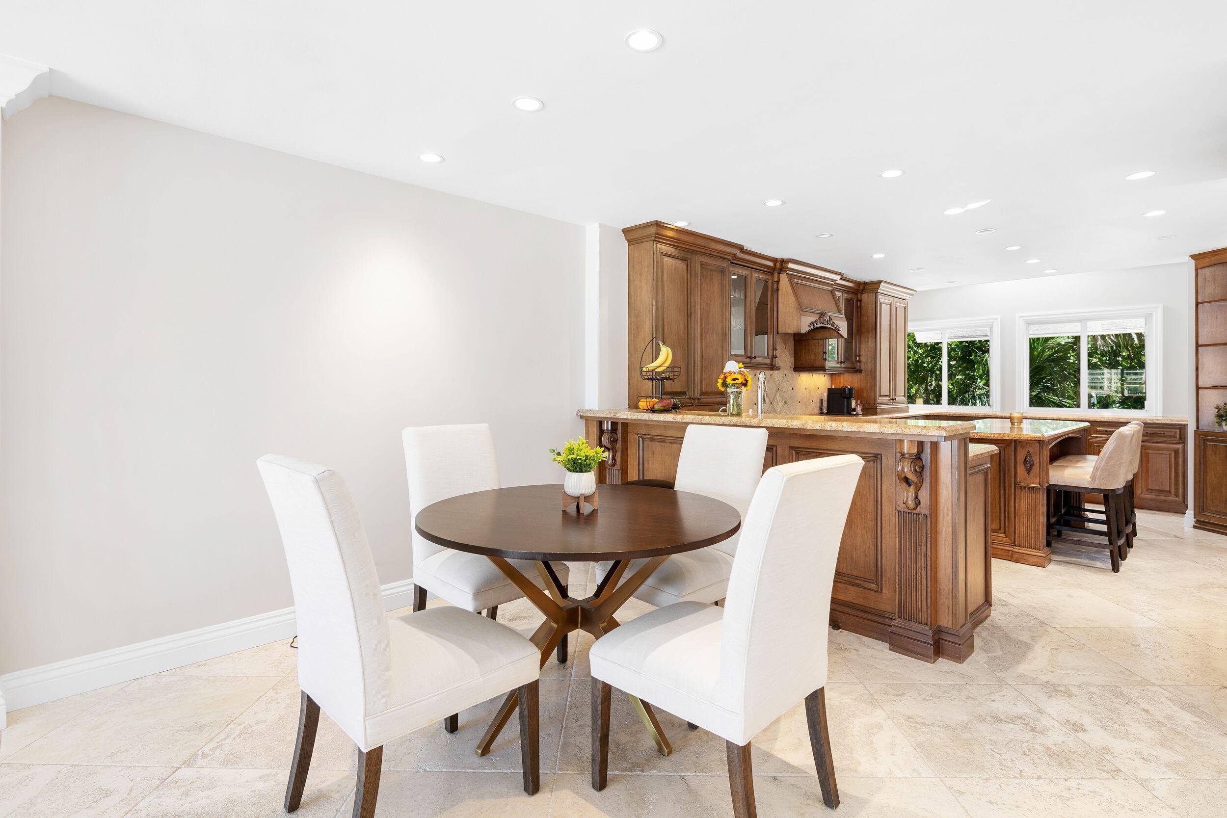 555 South Ocean Boulevard, Unit 4 Boca Raton, FL 33432 - Photo 16 of 39 a view of a dining room with furniture