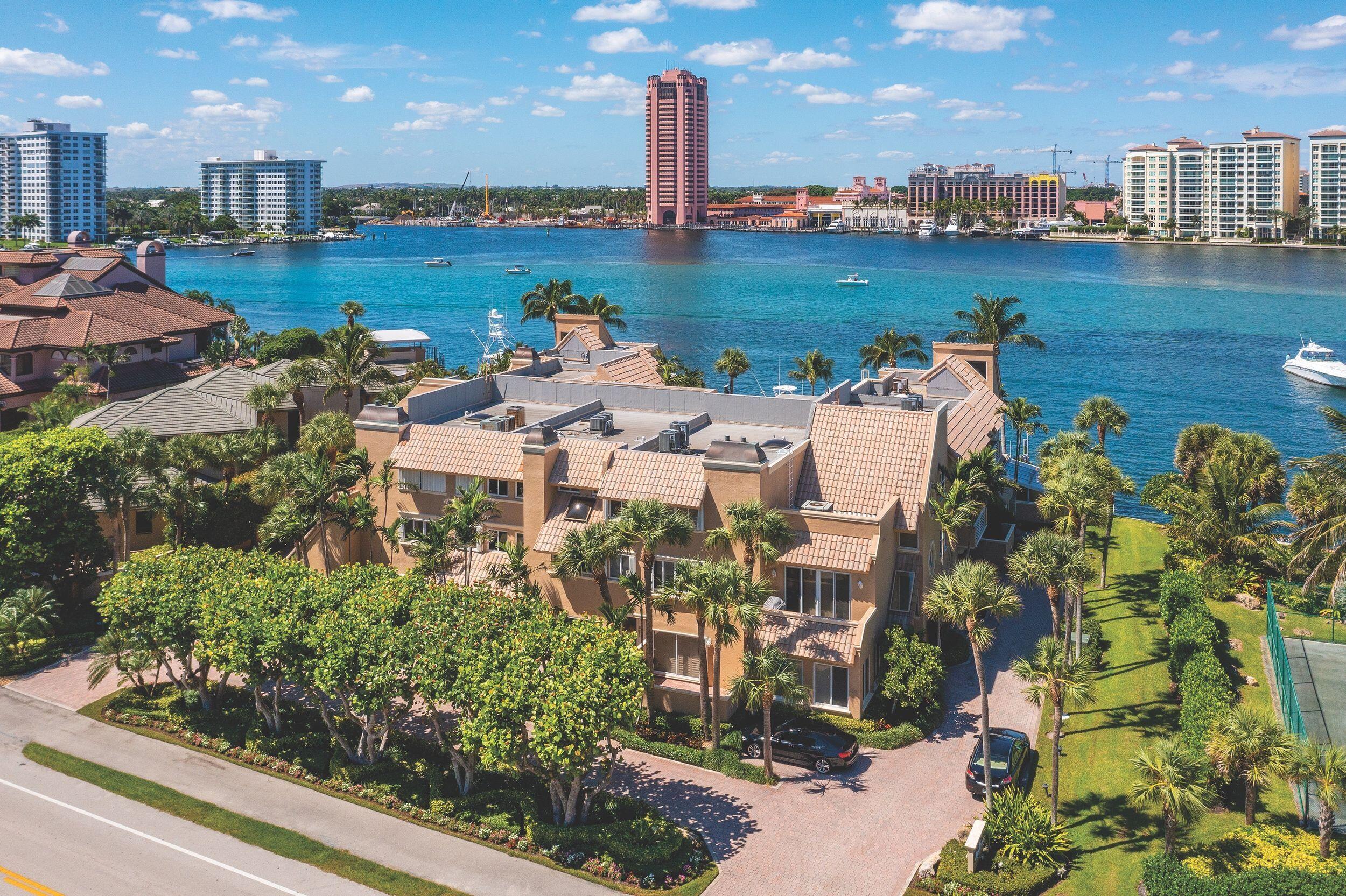 555 South Ocean Boulevard, Unit 4 Boca Raton, FL 33432 - Photo 2 of 39 a view of a lake with building in front of it