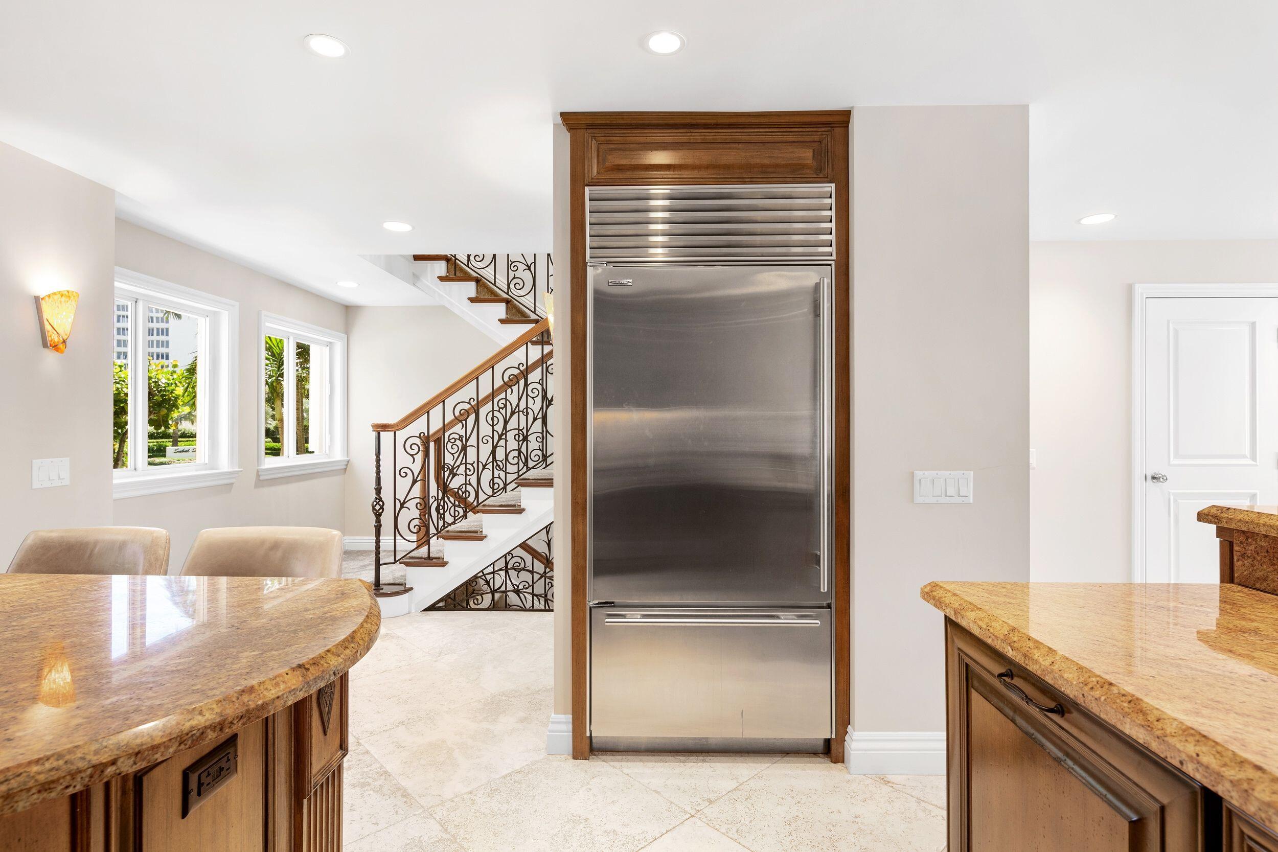 555 South Ocean Boulevard, Unit 4 Boca Raton, FL 33432 - Photo 21 of 39 a kitchen with granite countertop a stove and a refrigerator