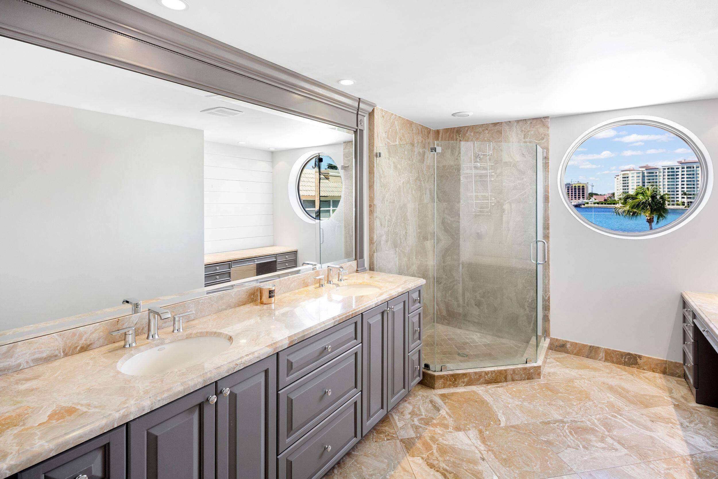 555 South Ocean Boulevard, Unit 4 Boca Raton, FL 33432 - Photo 27 of 39 a bathroom with a granite countertop sink mirror and double