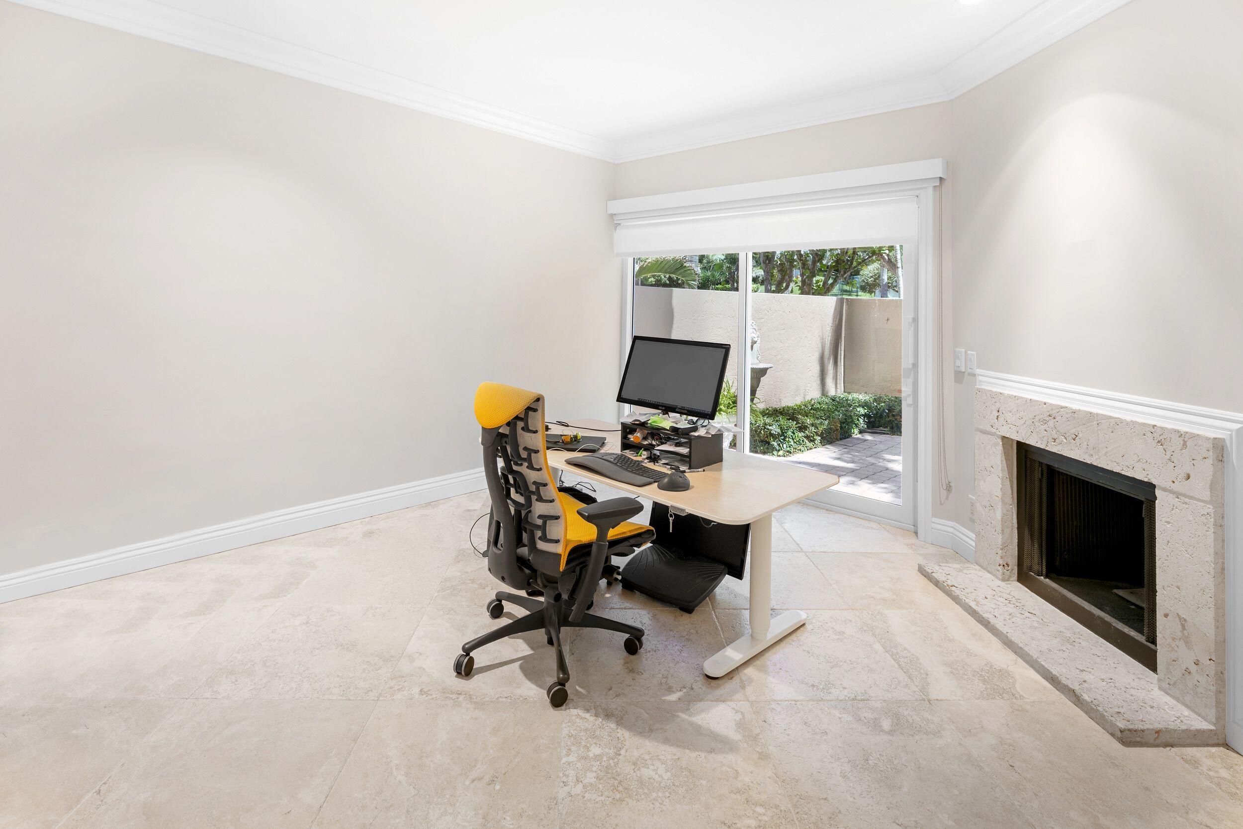 555 South Ocean Boulevard, Unit 4 Boca Raton, FL 33432 - Photo 33 of 39 a view of a workspace with furniture and a fireplace