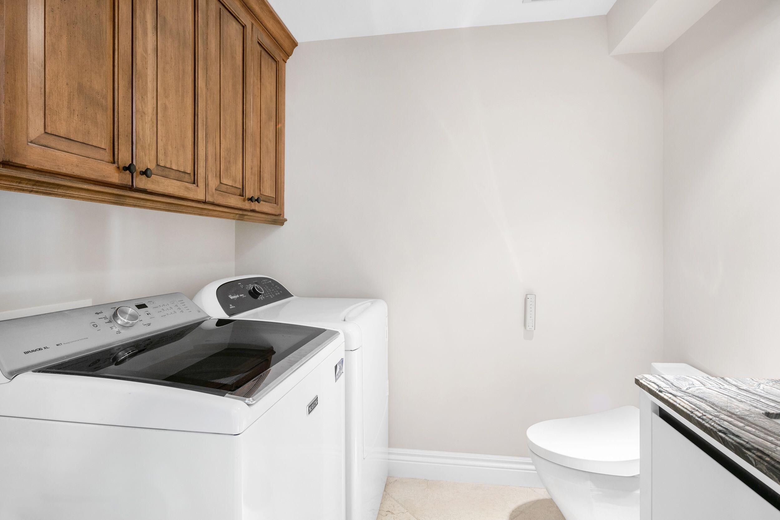 555 South Ocean Boulevard, Unit 4 Boca Raton, FL 33432 - Photo 35 of 39 a utility room with dryer and washer