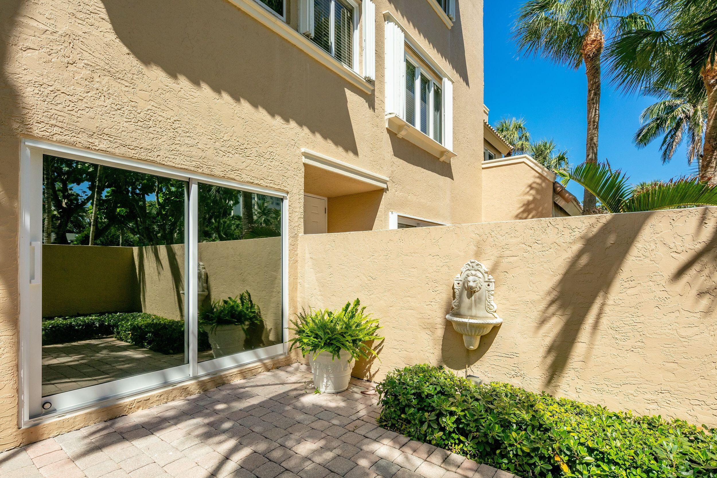 555 South Ocean Boulevard, Unit 4 Boca Raton, FL 33432 - Photo 38 of 39 a view of a house with a yard