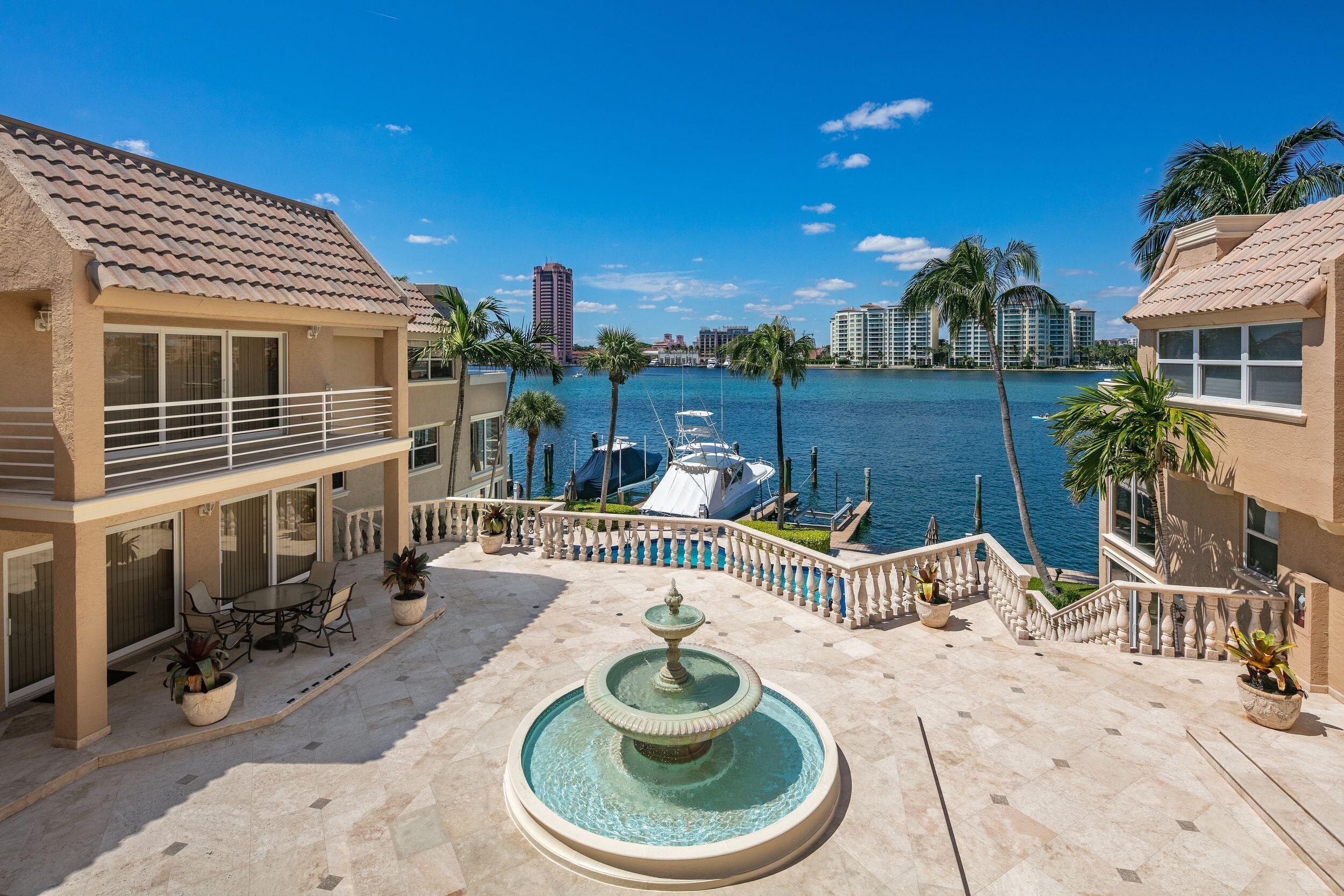 555 South Ocean Boulevard, Unit 4 Boca Raton, FL 33432 - Photo 9 of 39 a patio with a table and chairs and potted plants
