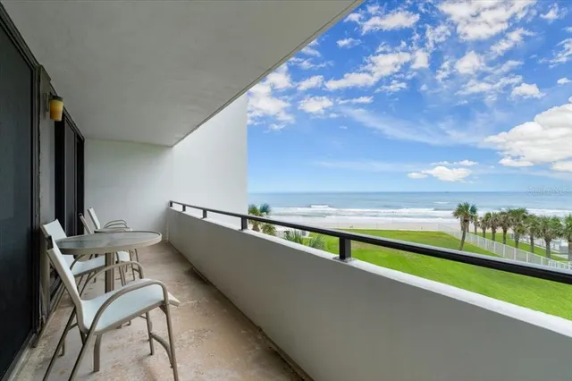 a view of swimming pool with seating space