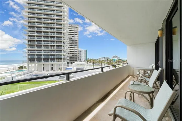a view of a balcony with chairs