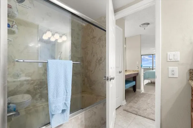 a bathroom with a shower and a sink