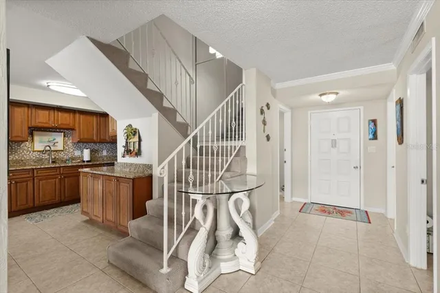 a view of a kitchen with a sink and a large window
