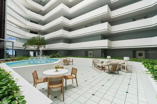 a view of swimming pool with seating space