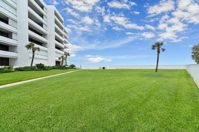 a swimming pool with outdoor seating and barbeque oven