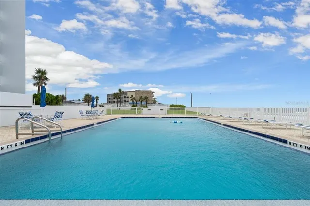 a view of a swimming pool with an ocean view