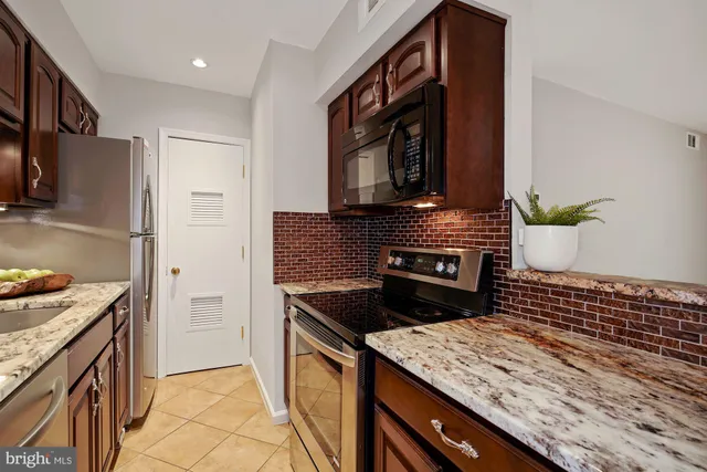 a kitchen with a stove and a microwave