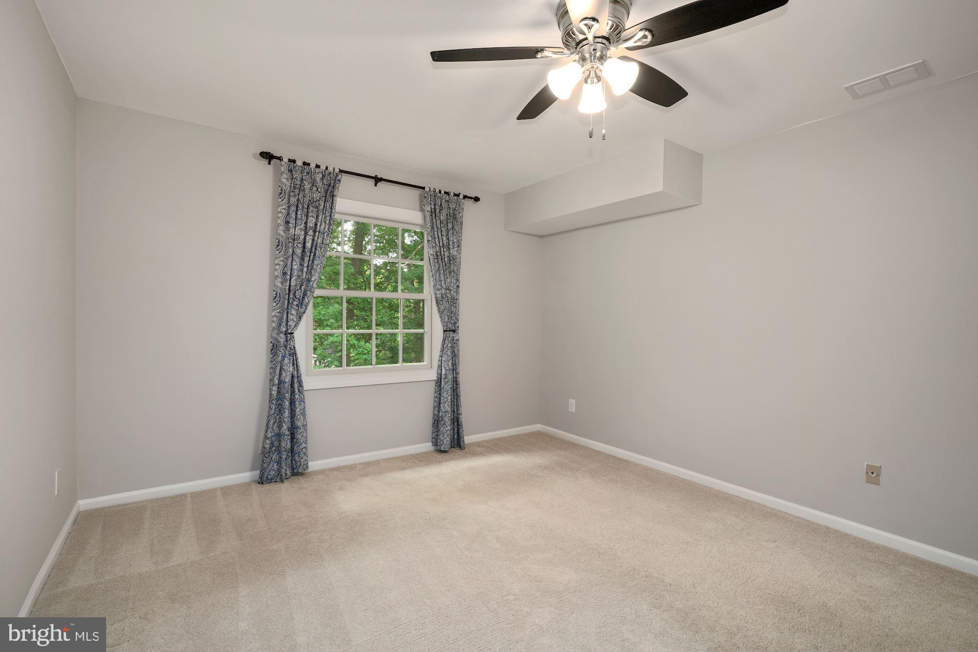 5907 G Kingsford Road, Unit 400 Springfield, VA 22152 - Photo 17 of 20 a view of an empty room with a window