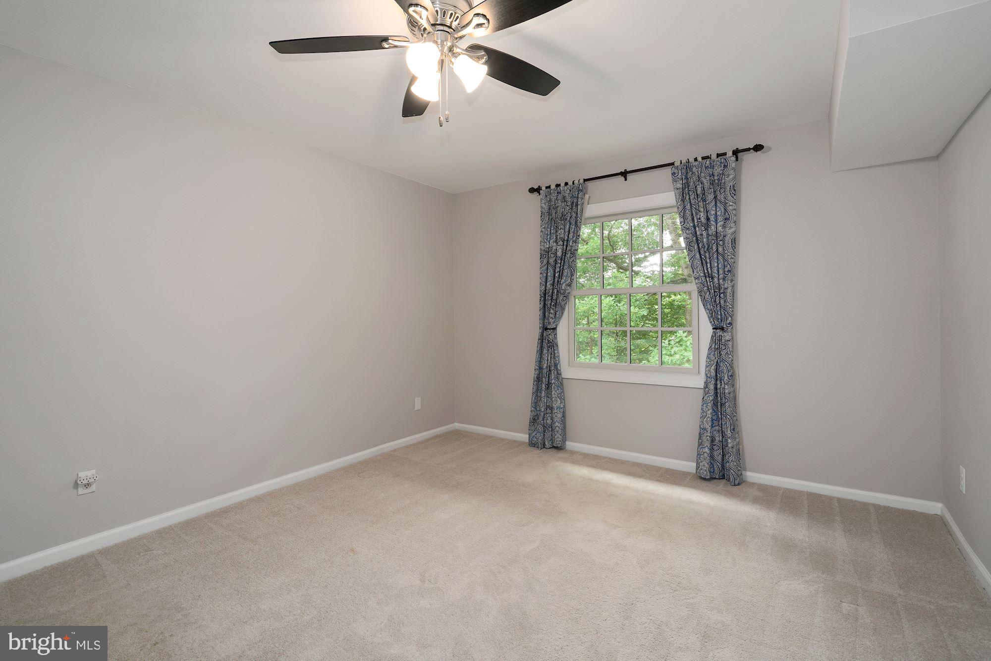 5907 G Kingsford Road, Unit 400 Springfield, VA 22152 - Photo 18 of 20 a view of an empty room with a window