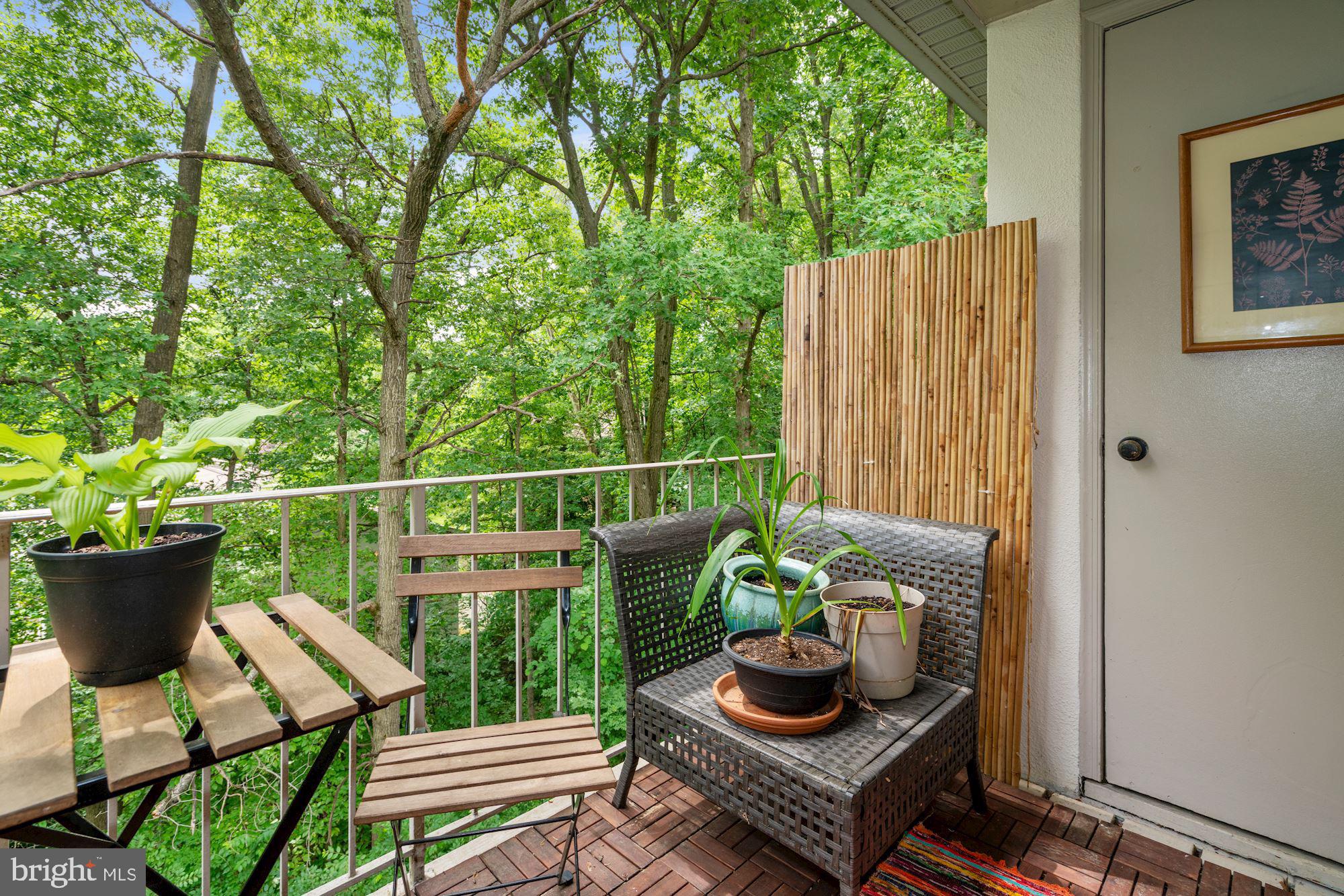 5907 G Kingsford Road, Unit 400 Springfield, VA 22152 - Photo 20 of 20 a view of a porch with furniture and a potted plant