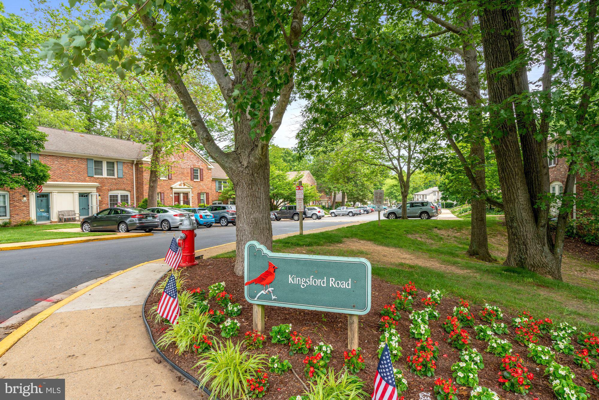 5907 G Kingsford Road, Unit 400 Springfield, VA 22152 - Photo 2 of 20 a sign that is sitting in front of flowers