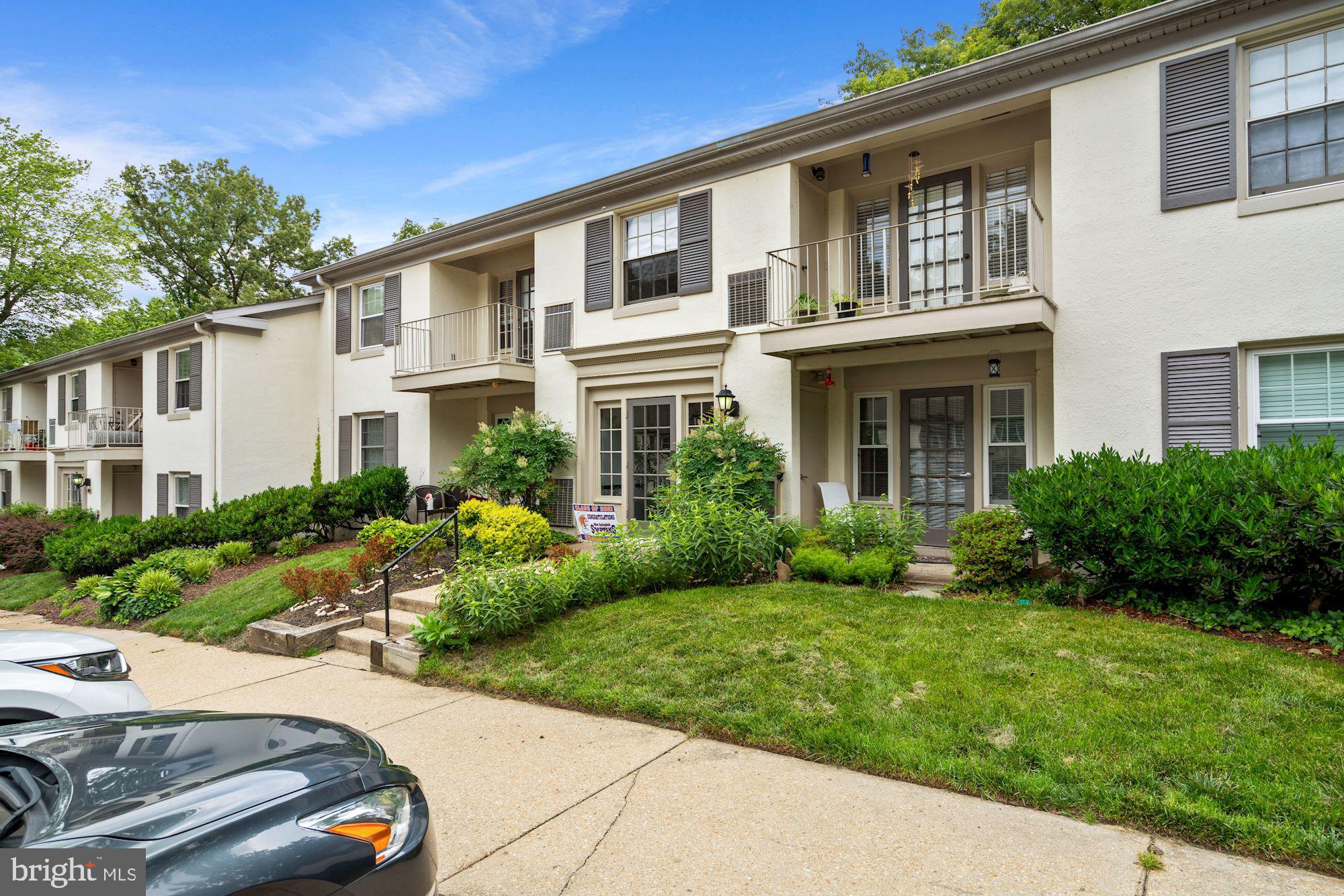 5907 G Kingsford Road, Unit 400 Springfield, VA 22152 - Photo 3 of 20 a front view of a house with garden