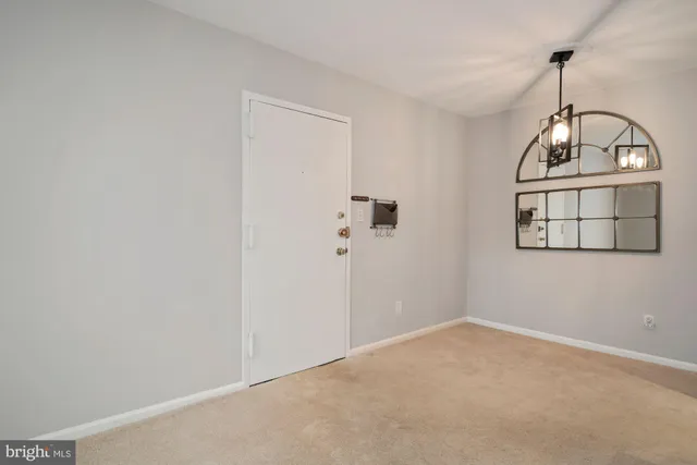 a view of a livingroom with wooden floor and window