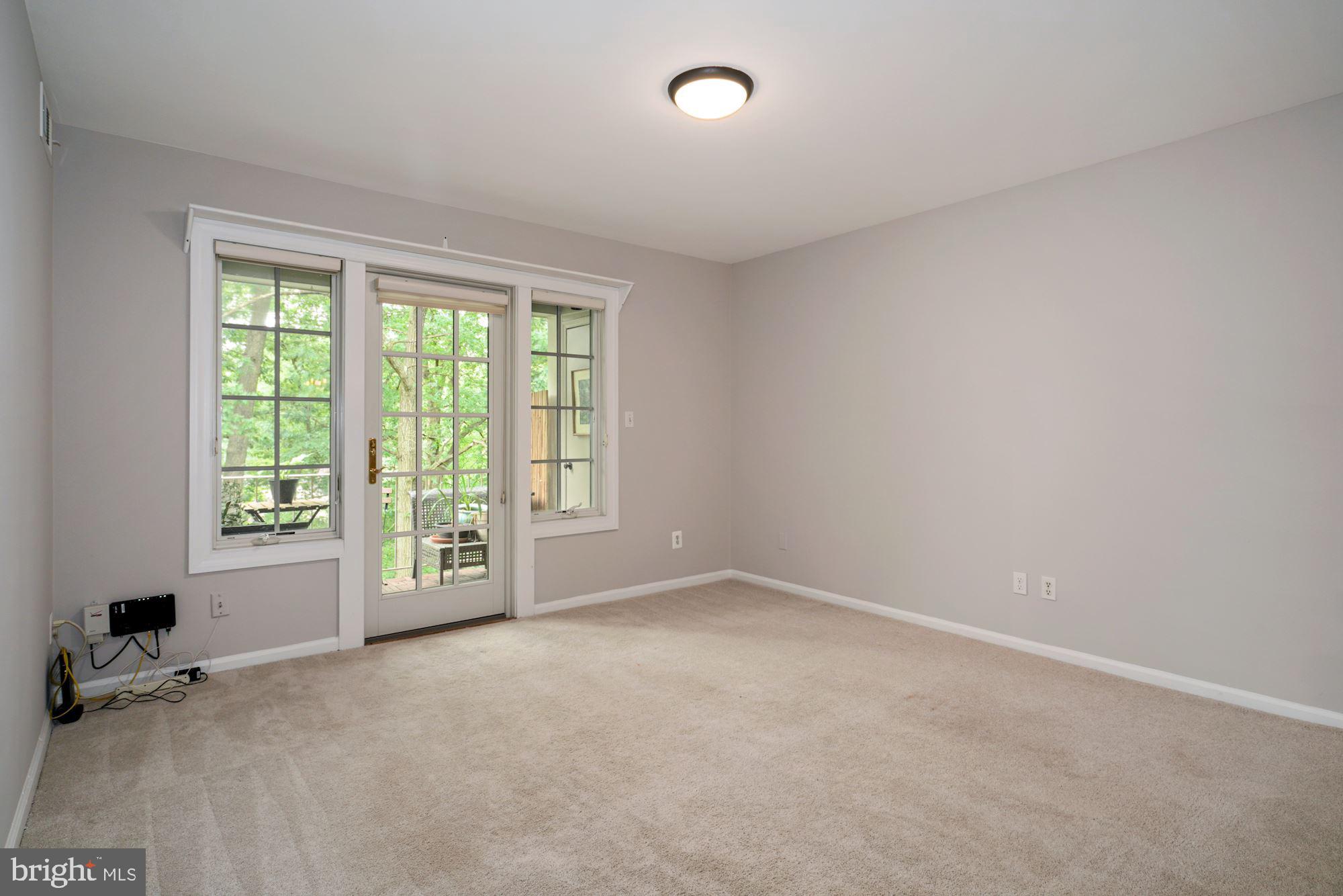 5907 G Kingsford Road, Unit 400 Springfield, VA 22152 - Photo 6 of 20 an empty room with windows