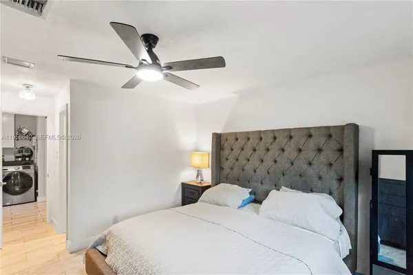 a bedroom with a bed and cabinets