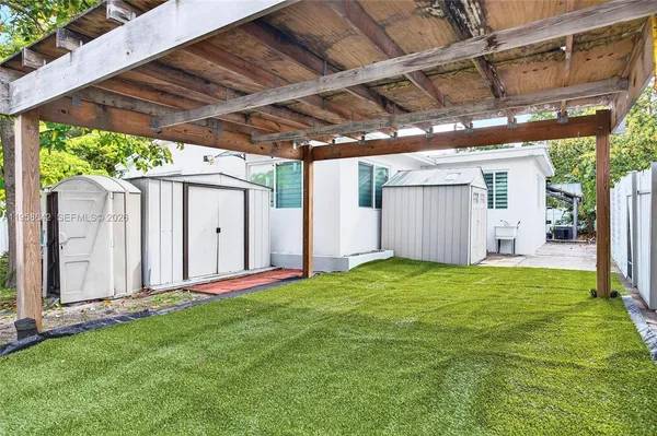 a view of a backyard with plants