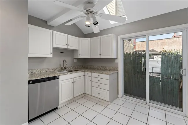 a kitchen with granite countertop cabinets and stainless steel appliances