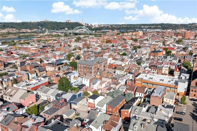 an aerial view of residential building with parking space
