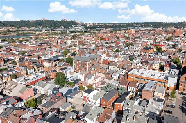 an aerial view of a city with lots of residential buildings