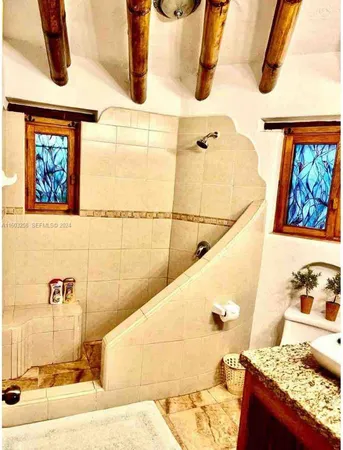 a bedroom with a bed and a walk in closet