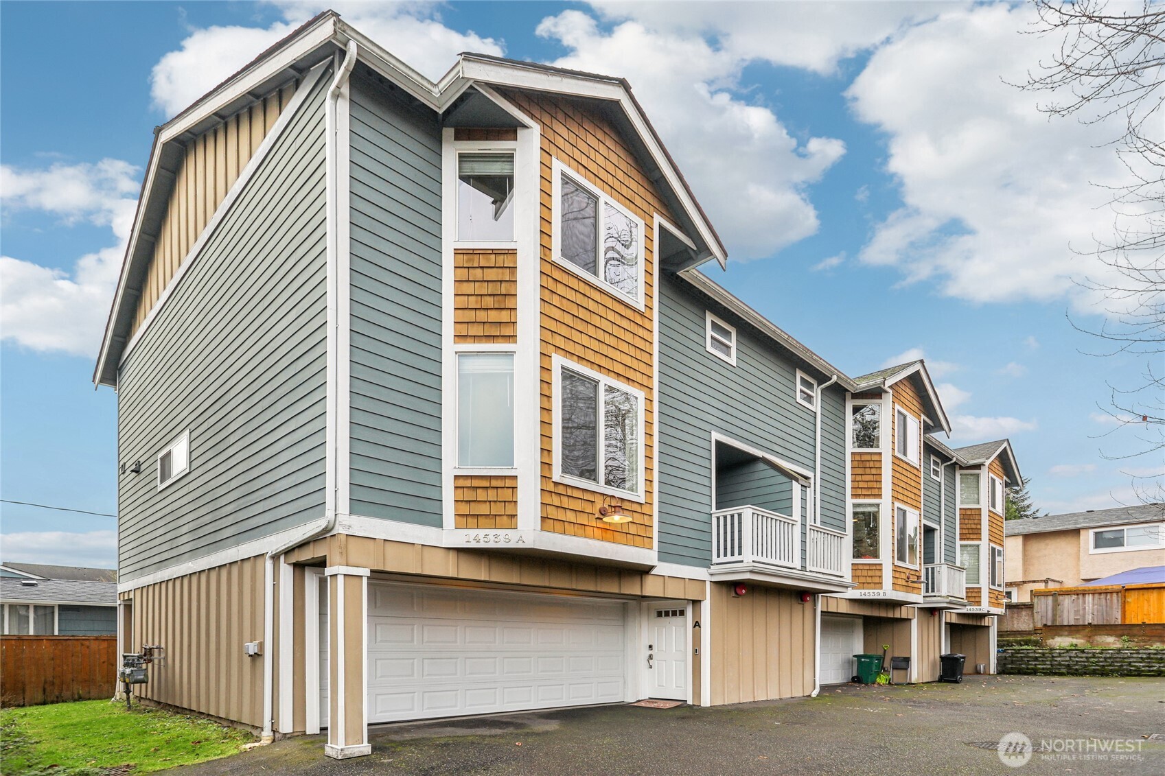 a front view of a house with a garage