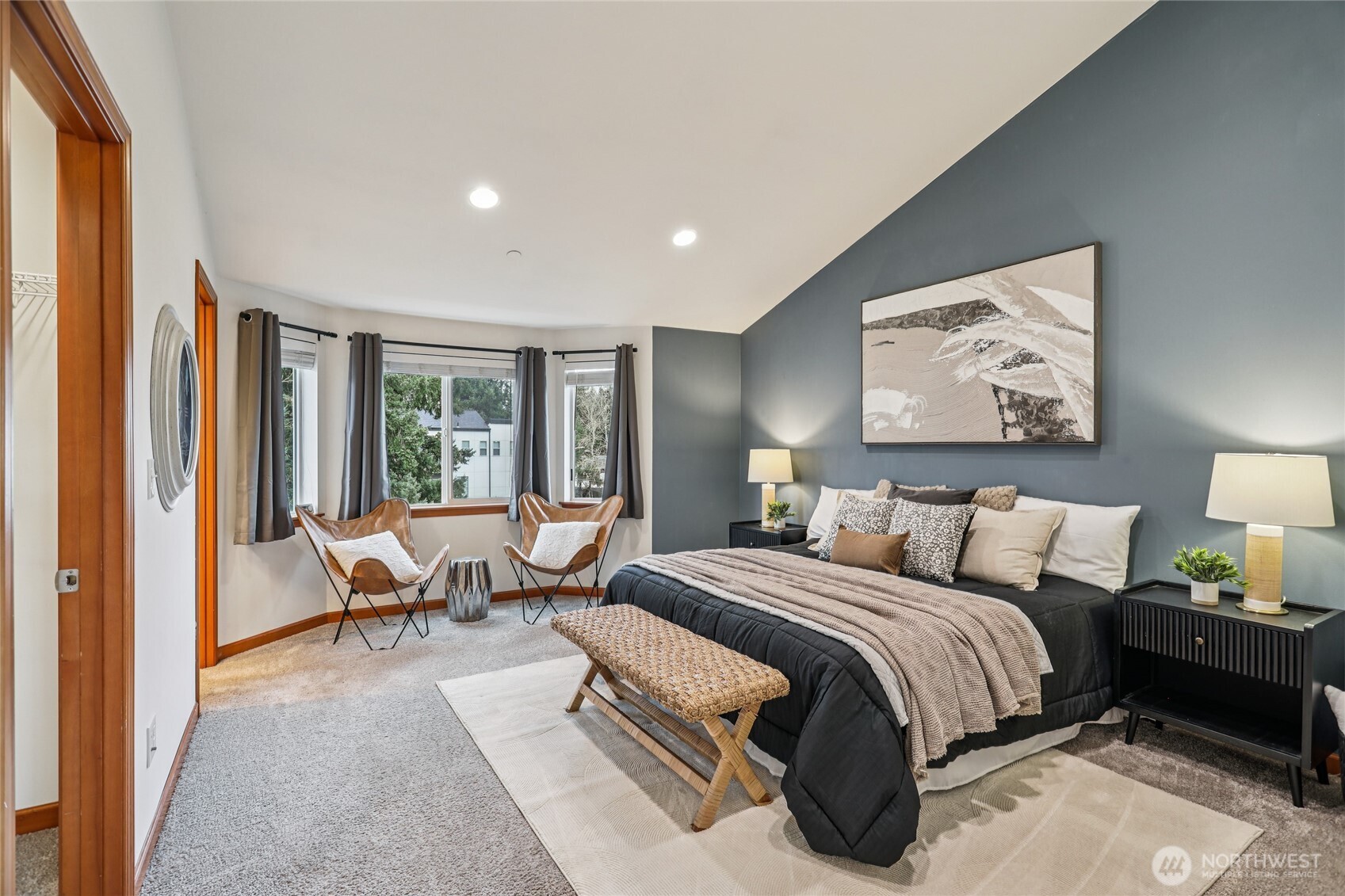 14539 32nd Avenue Northeast, Unit A Shoreline, WA 98155 - Photo 13 of 27 a bedroom with a bed and glass window