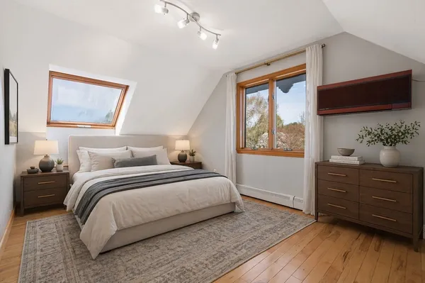 a bedroom with a bed and a dresser
