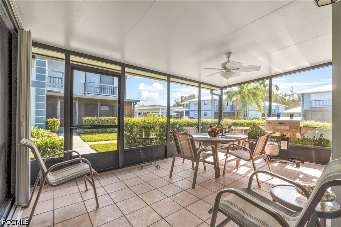 707 Hoover Dike Road, Unit 904 Clewiston, FL 33440 - Photo 13 of 41 a dining room with furniture and a floor to ceiling window
