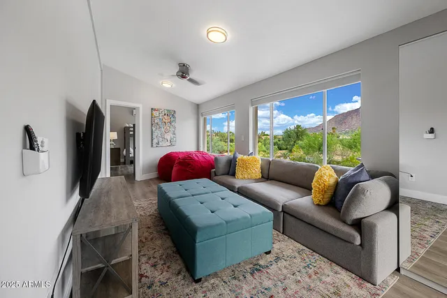 a living room with furniture and a large window