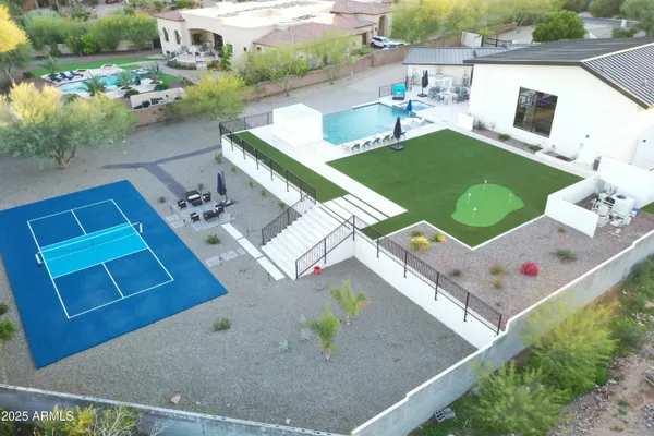 an aerial view of a house with outdoor space