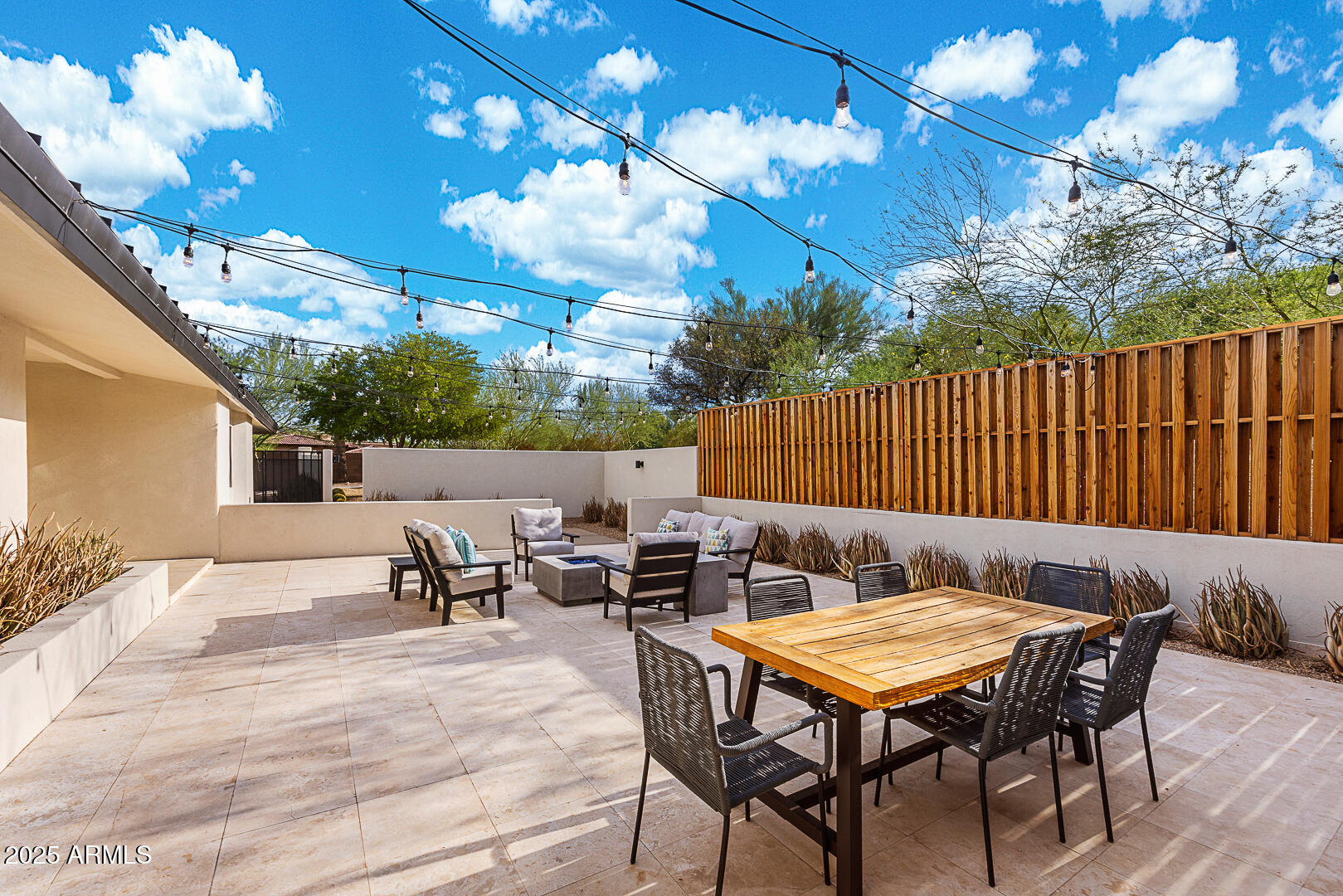 7111 North Quartz Mountain Road Paradise Valley, AZ 85253 - Photo 7 of 22 a backyard of a house with table and chairs