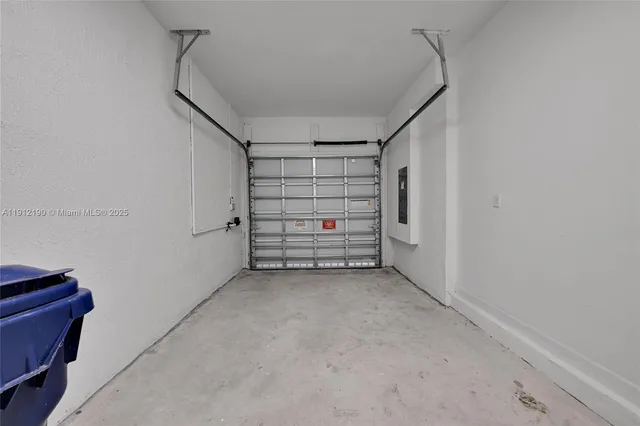 a view of room that has a white walls