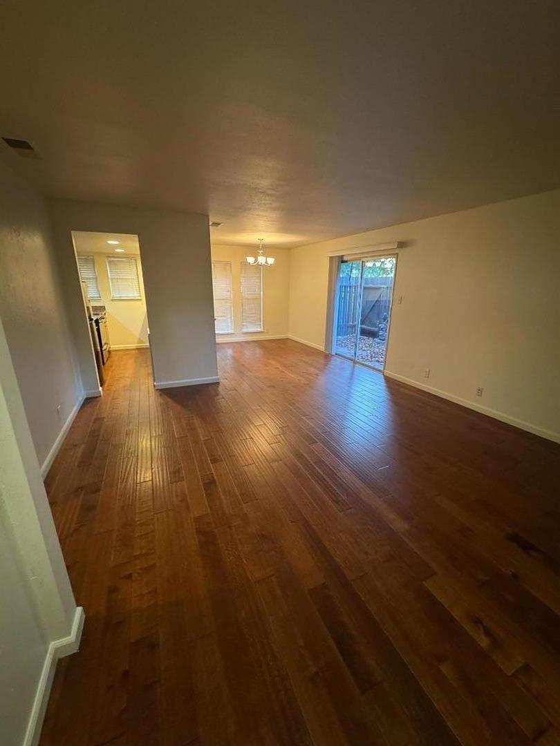 5434 Roundtree Court, Unit A Concord, CA 94521 - Photo 3 of 10 a view of empty room with wooden floor