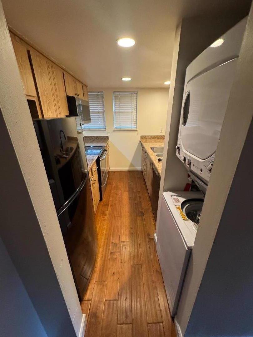 5434 Roundtree Court, Unit A Concord, CA 94521 - Photo 4 of 10 a view of a kitchen with furniture and wooden floor