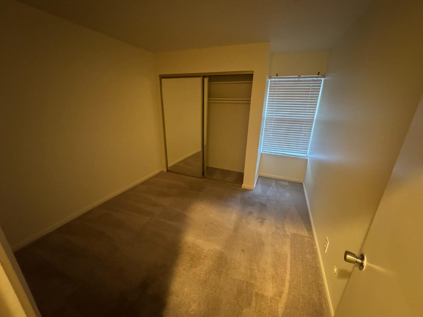5434 Roundtree Court, Unit A Concord, CA 94521 - Photo 8 of 10 an empty room with closet
