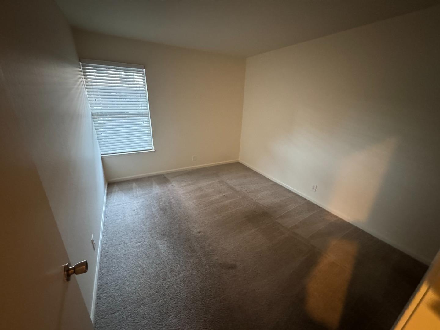 5434 Roundtree Court, Unit A Concord, CA 94521 - Photo 9 of 10 an empty room with windows