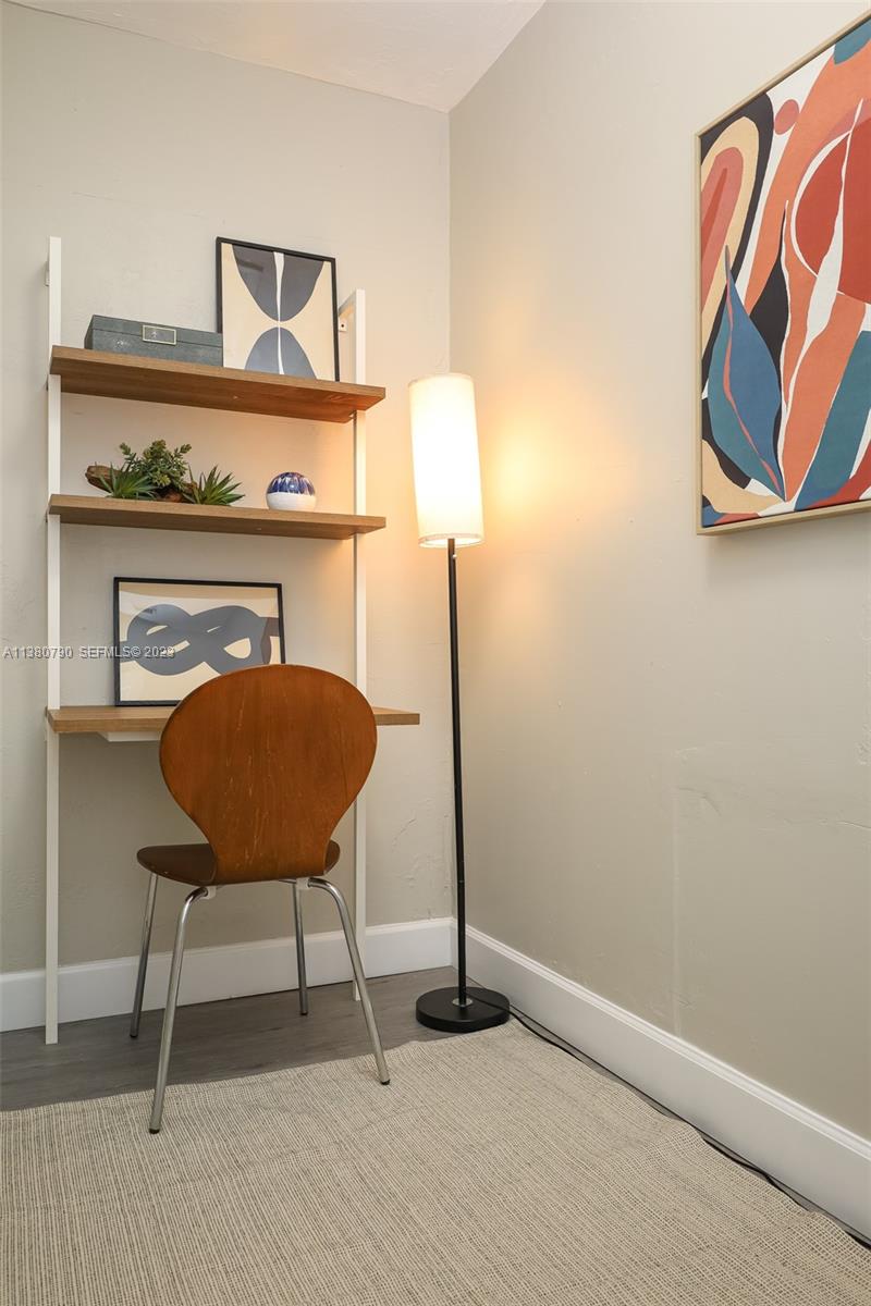 2761 Southwest 33rd Avenue, Unit 2 Miami, FL 33133 - Photo 28 of 33 a room with a table and a chair