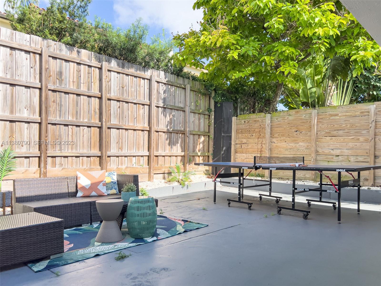 2761 Southwest 33rd Avenue, Unit 2 Miami, FL 33133 - Photo 31 of 33 a building outdoor space with patio furniture and potted plants