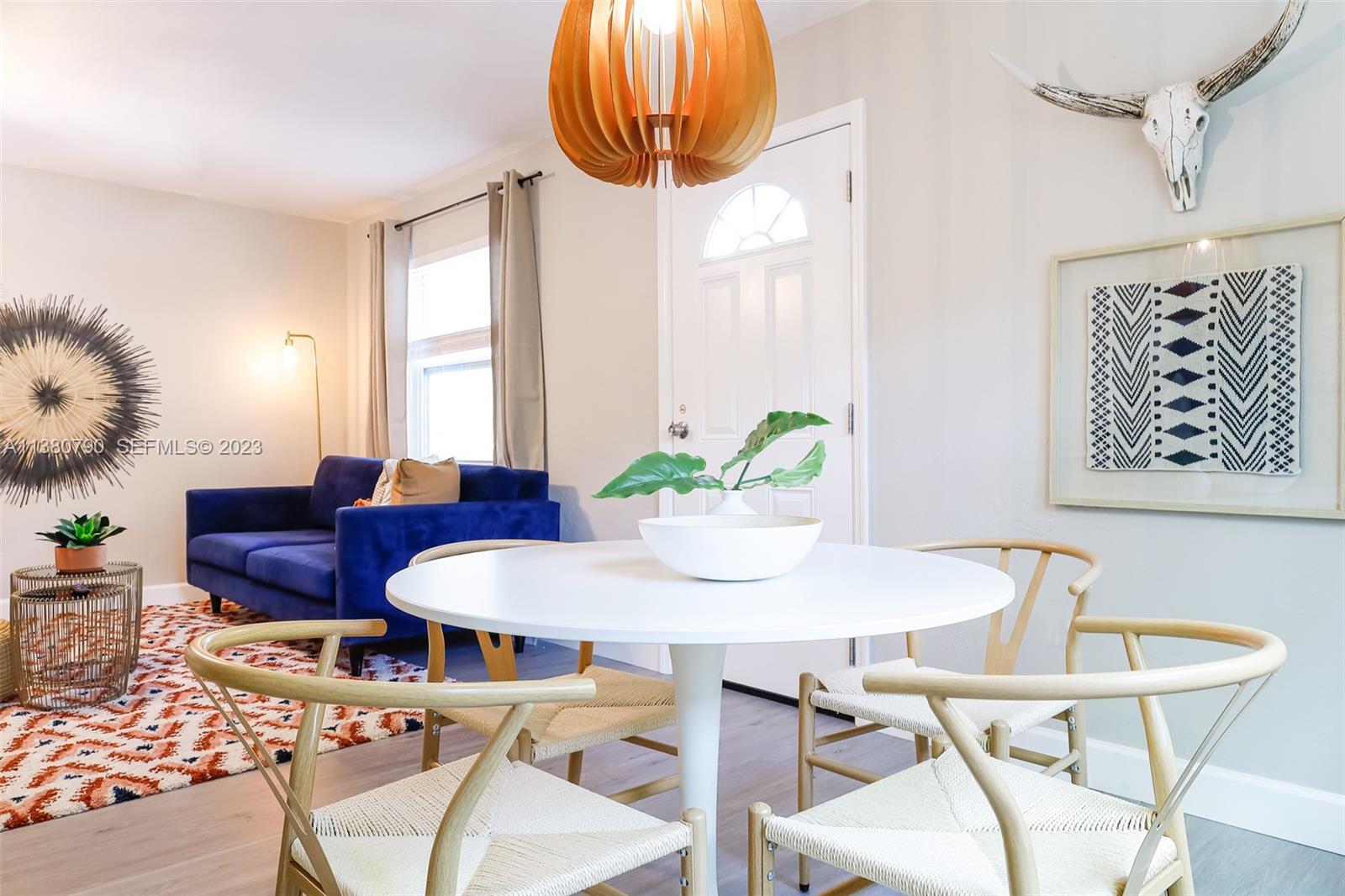 2761 Southwest 33rd Avenue, Unit 2 Miami, FL 33133 - Photo 8 of 33 a view of a dining room with furniture and a chandelier