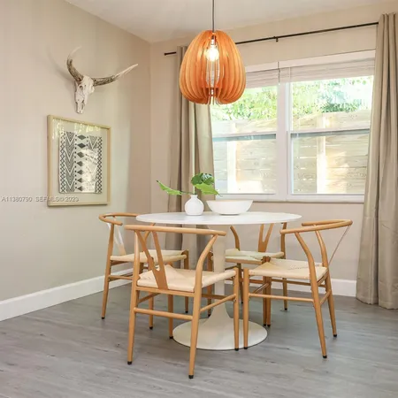 a dining room table chairs and a table