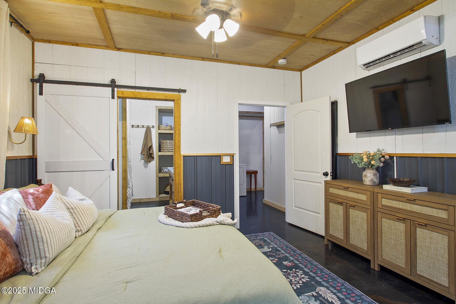 355 Dumas Road Forsyth, GA 31029 - Photo 18 of 53 a bed room with a bed and a television