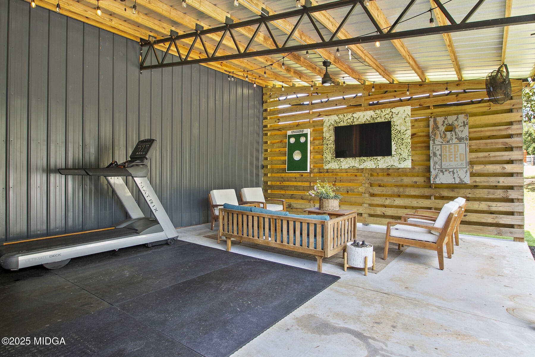 355 Dumas Road Forsyth, GA 31029 - Photo 29 of 53 a view of a porch with furniture and floor to ceiling window